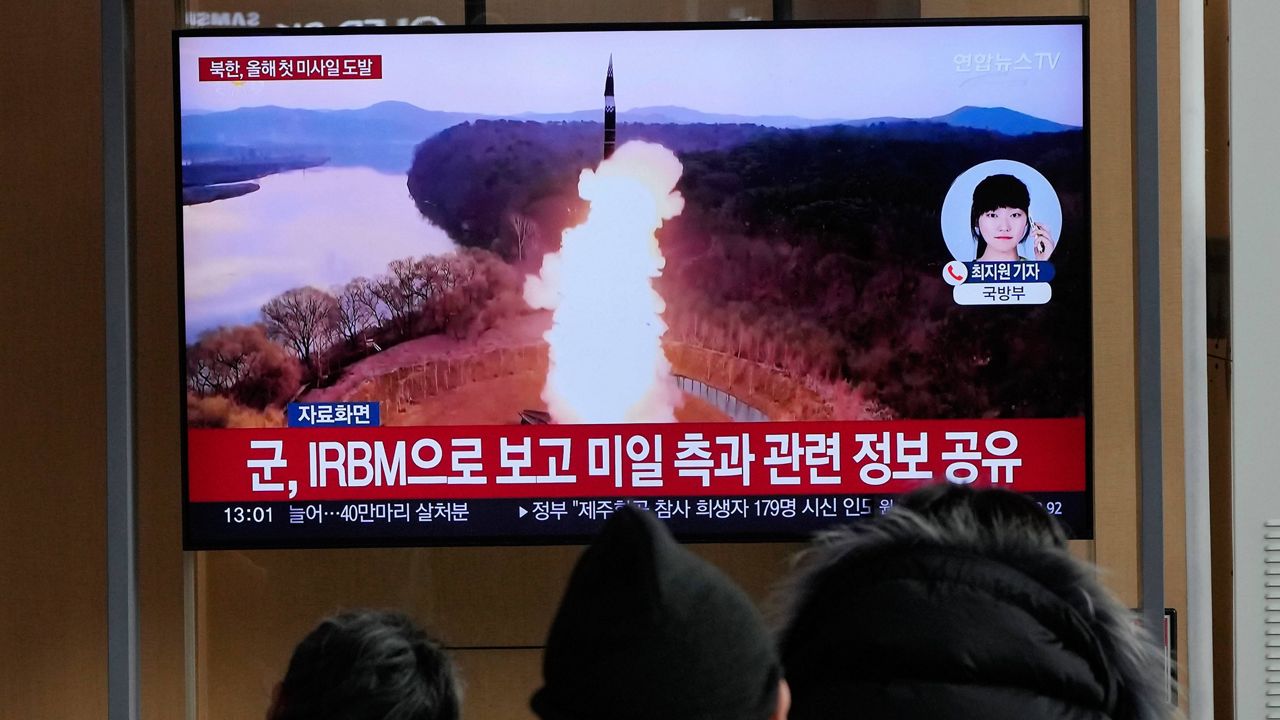 A TV screen shows a file image of North Korea's missile launch during a news program at Seoul Railway Station in Seoul, South Korea, Monday, Jan. 6, 2025. (AP Photo/Ahn Young-joon)