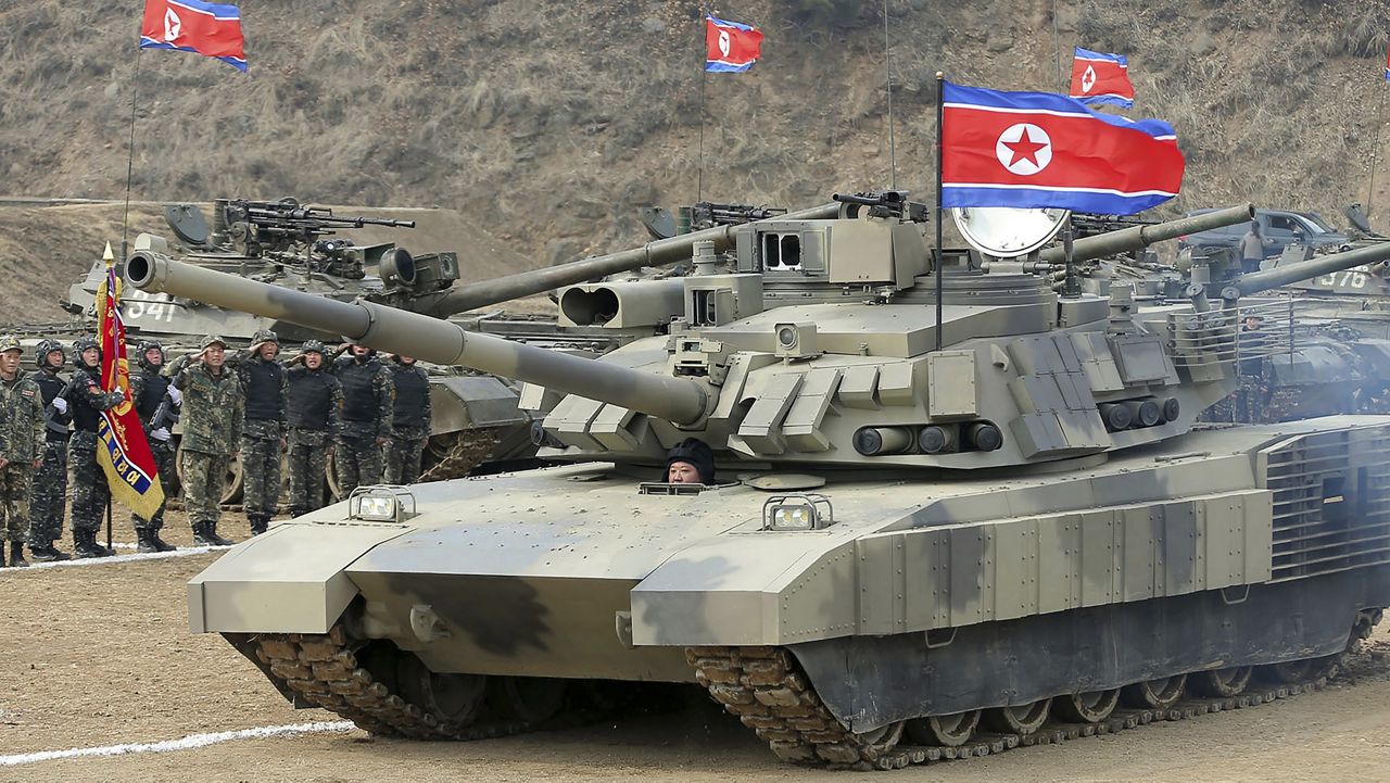 In this photo provided by the North Korean government, North Korean leader Kim Jong Un drives a new-type tank in North Korea Wednesday, March 13, 2024. (Korean Central News Agency/Korea News Service via AP)