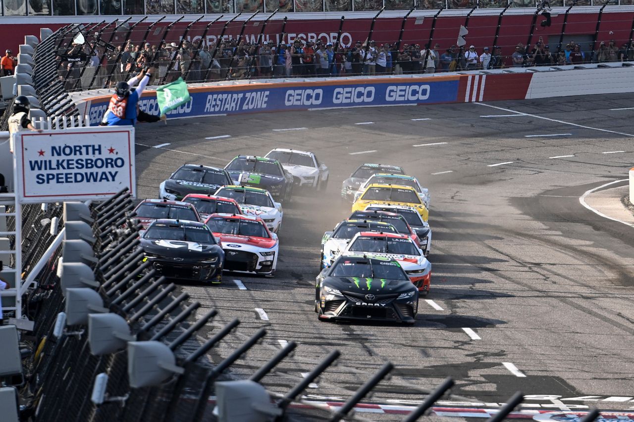 Ty Gibbs (54) leads a pack of cars to the green flag during the NASCAR All-Star Open Cup Series auto race at North Wilkesboro Speedway, Sunday, May 21, 2023, in North Wilkesboro, N.C. (AP Photo/Matt Kelley)