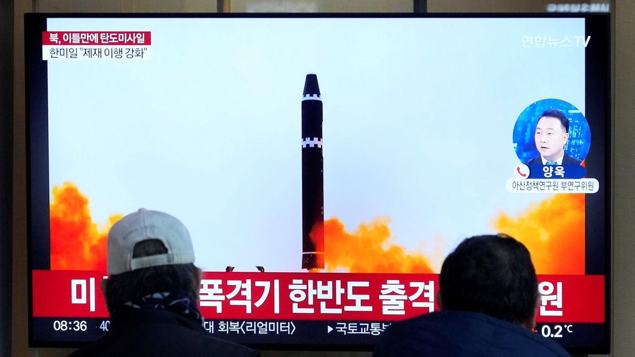 A TV screen shows a file image of North Korea's missile launch during a news program at the Seoul Railway Station in Seoul, South Korea, Monday, Feb. 20, 2023. North Korea has fired a pair of short-range ballistic missiles off its east coast on Monday, South Korea's military said, two days after the North resumed testing activities with an intercontinental ballistic missile launch. (AP Photo/Ahn Young-joon)
