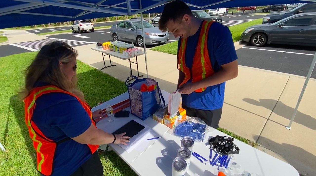 Northrup Grumman employees took to the streets Friday to clean up NASA Boulevard. (Spectrum News 13/Greg Pallone) 