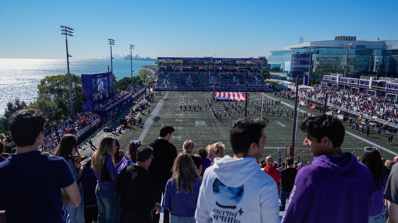 The Star-Spangled Banner is played before the first half of an NCAA college football game between Wisconsin and Northwestern