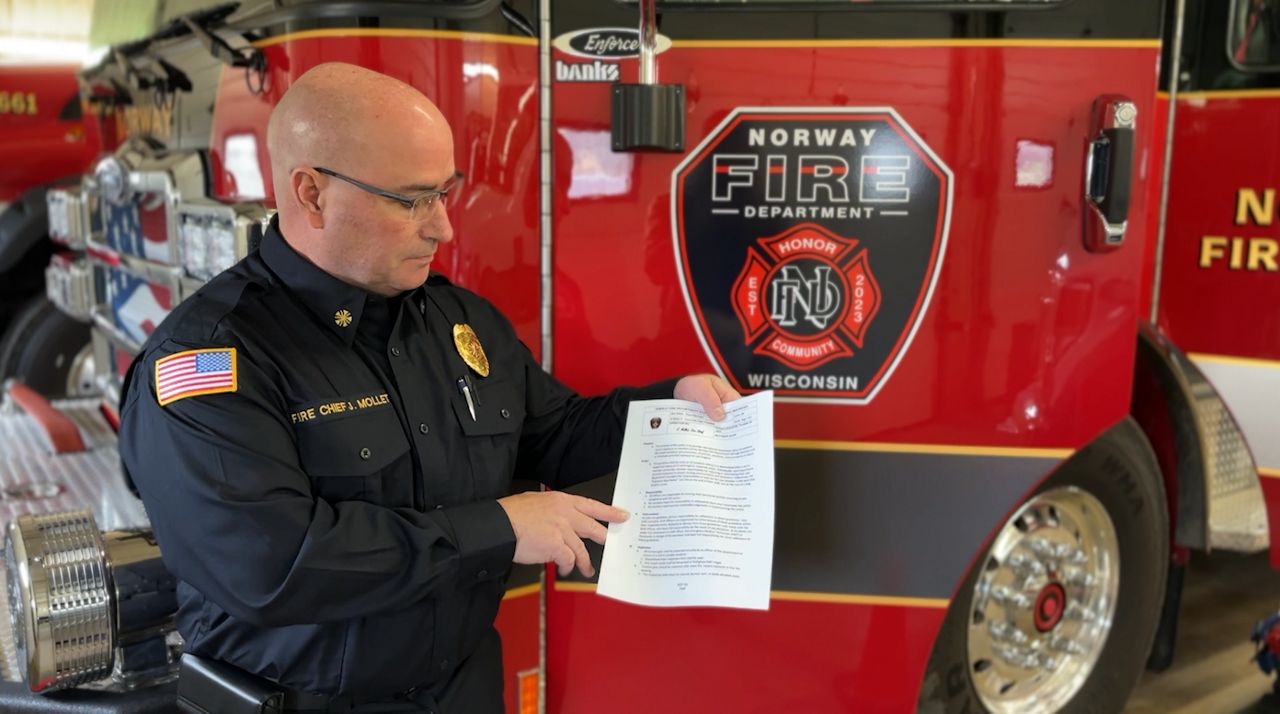 Chief Mollet reviews plans and procedures made for cancer prevention at his department.