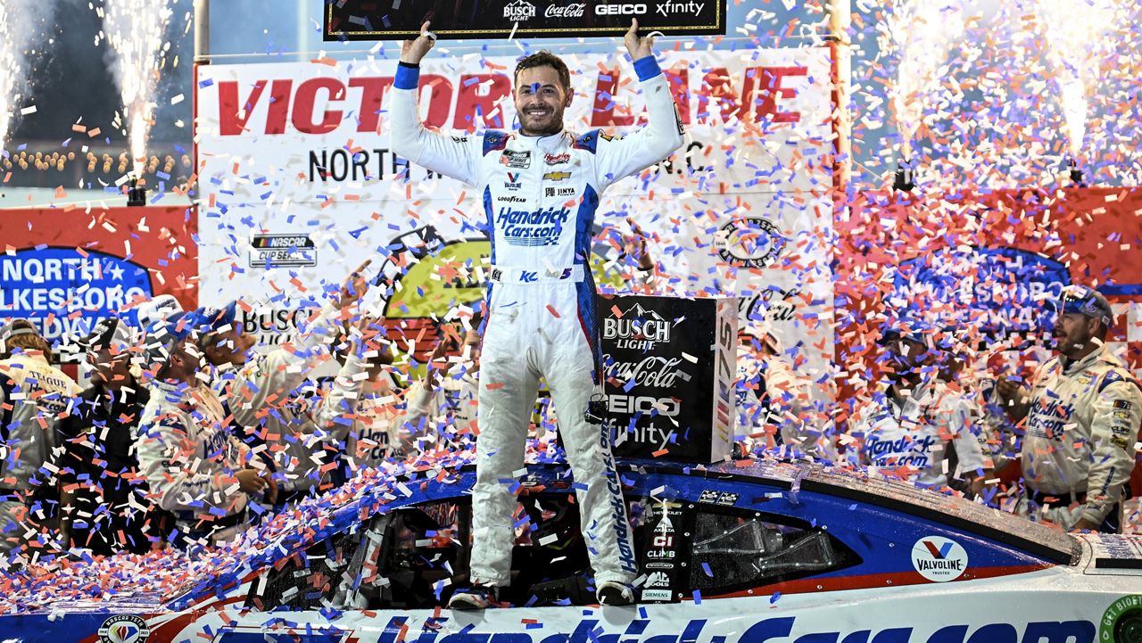 Kyle Larson (5) celebrates in Victory Lane after winning the NASCAR All-Star Cup Series auto race at North Wilkesboro Speedway, Sunday, May 21, 2023, in North Wilkesboro, N.C. (AP Photo/Matt Kelley)