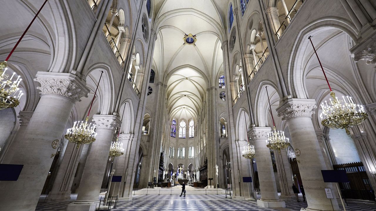 The nave of Notre Dame Cathedral is seen while French President Emmanuel Macron visits the restored interiors of the cathedral, Friday Nov. 29, 2024, in Paris. (Stephane de Sakutin, Pool via AP)