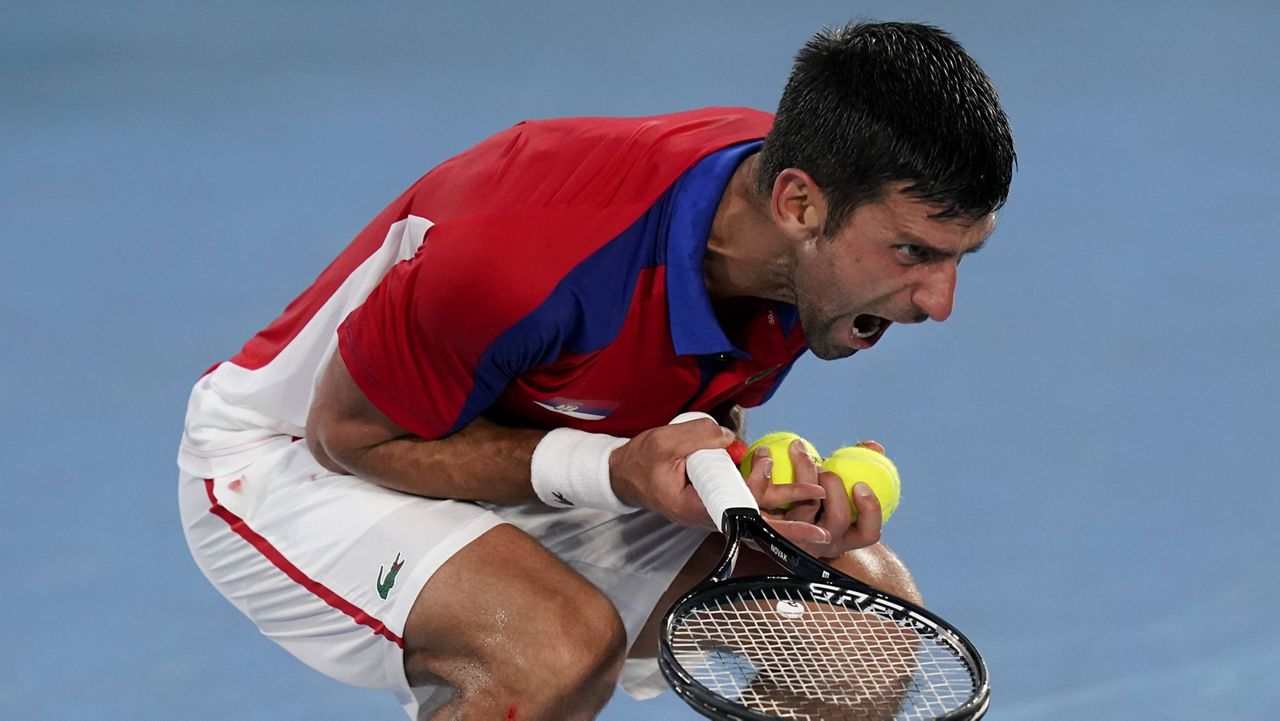 Novak Djokovic reacts Friday during a semifinal men's tennis match against Alexander Zverev at the Olympics in Tokyo. (AP Photo/Patrick Semansky)