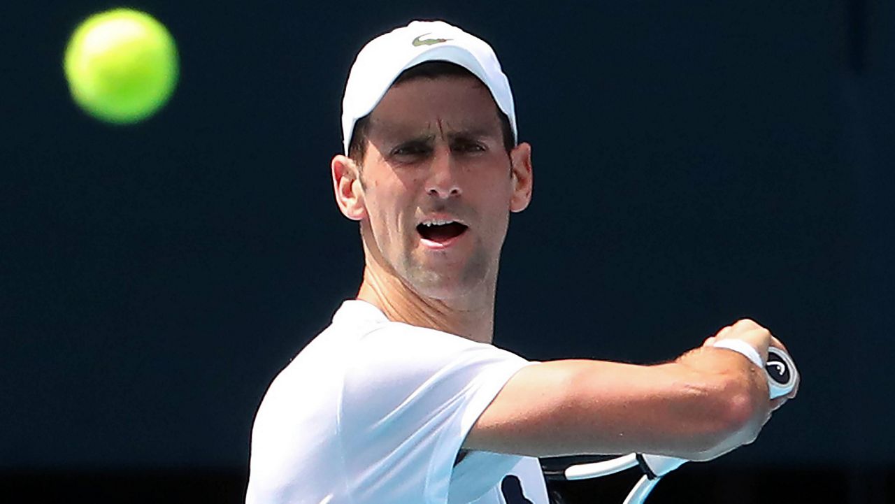Novak Djokovic practices Tuesday at Rod Laver Arena in Melbourne, Australia. (Kelly Defina/Pool Photo via AP, File)