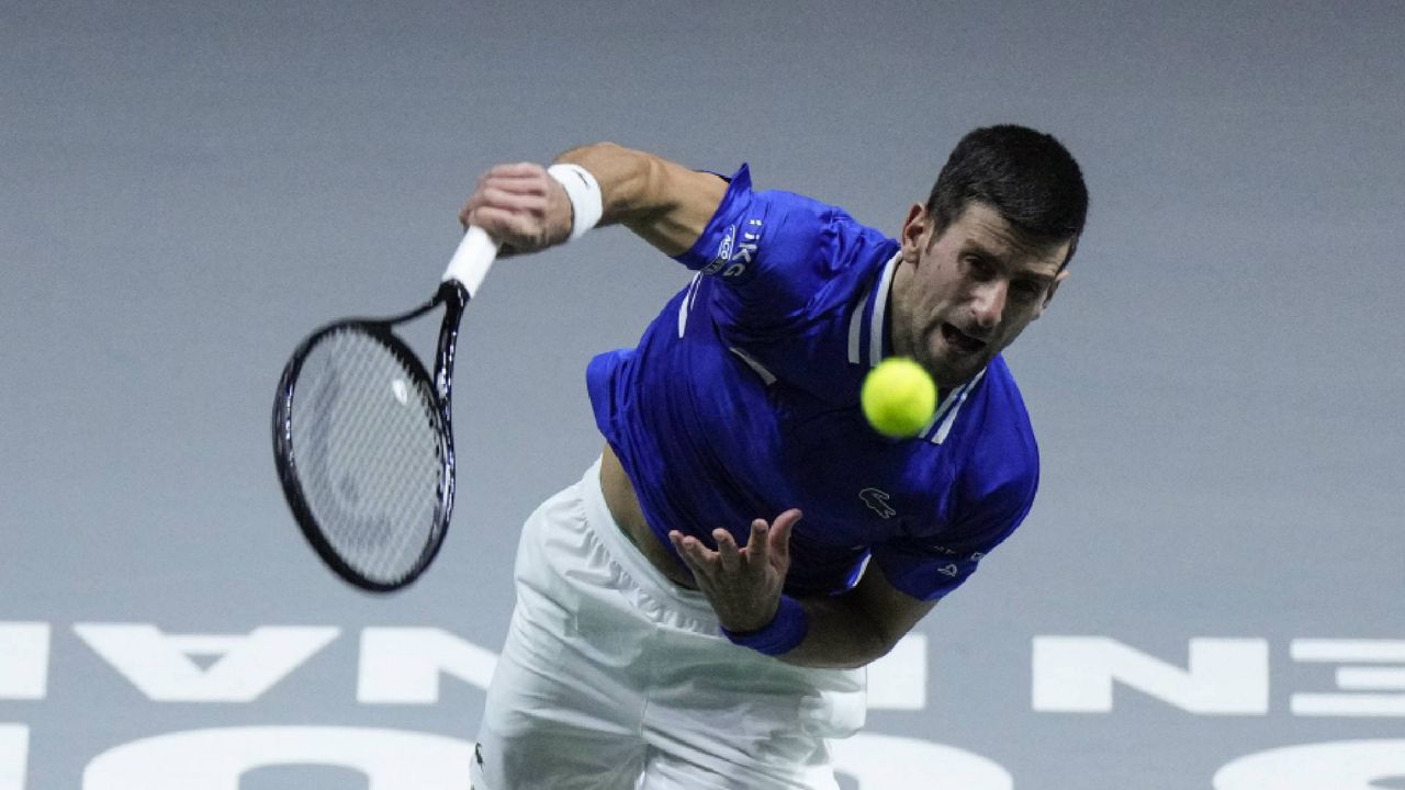 FILE - Serbia's Novak Djokovic serves the ball to Croatia's Marin Cilic during their Davis Cup tennis semi-final match at Madrid Arena in Madrid, Spain, Friday, Dec. 3, 2021. Top-ranked Novak Djokovic has withdrawn from the ATP Cup in Australia ahead of the first Grand Slam of the season. Cup organizers didn't give a reason. The 34-year-old Serbian has declined to comment on his vaccination status in recent months and Australia’s strict regulations require all players, officials and fans to be fully vaccinated for COVID-19. (AP Photo/Bernat Armangue)