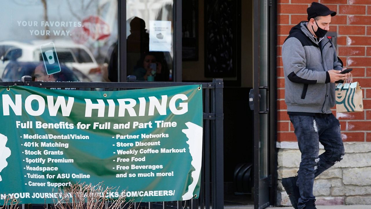 A hiring sign is displayed Friday outside of a Starbucks in Schaumburg, Ill. (AP Photo/Nam Y. Huh) 