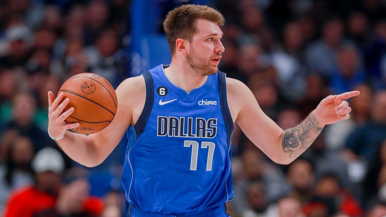 Dallas Mavericks point guard Luka Doncic (77) instructs the offense during the second half of an NBA basketball game against the Denver Nuggets, Friday, Nov. 18, 2022, in Dallas. (AP Photo/Gareth Patterson)