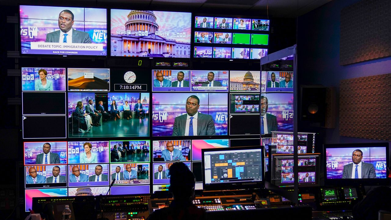 Assemblywoman Yuh-Line Niou, Rep. Mondaire Jones, Assemblywoman Jo Anne Simon, Councilwoman Carlina Rivera, Elizabeth Holtzman, and Attorney Dan Goldman are seen in the control room while they debate in New York's 10th Congressional District Democratic primary debate hosted by Spectrum News NY1 and WNYC, Wednesday, Aug. 10, 2022, at the CUNY Graduate Center in New York. (AP Photo/Mary Altaffer, Pool)