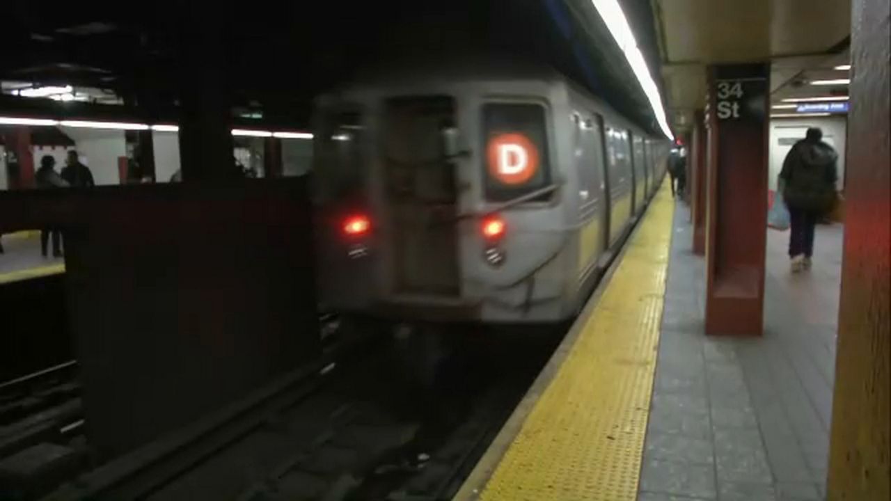 A D train pulls into the 34th St.-Herald Square station.