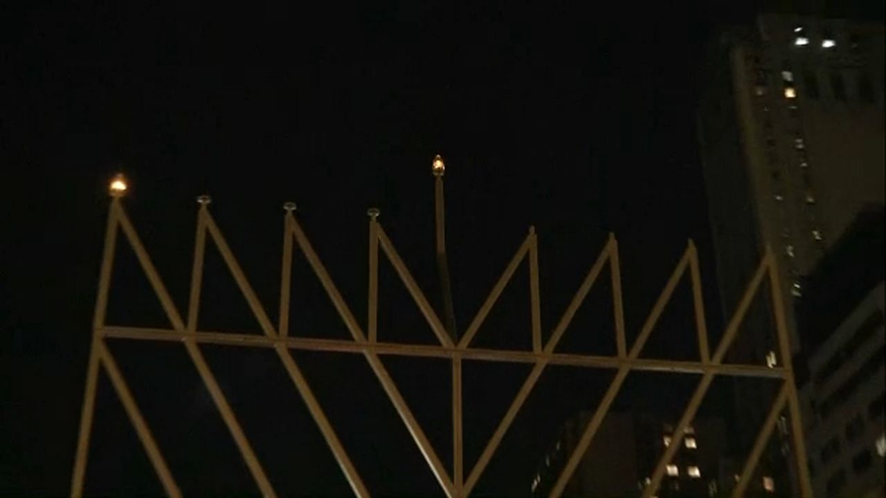 32foothigh menorah lit up at Manhattan Grand Army Plaza