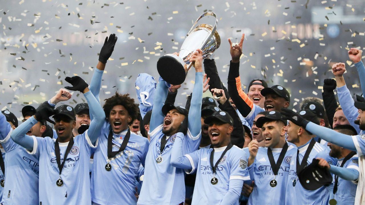 NYCFC players celebrate after winning the MLS Cup on Saturday, Dec. 11, 2021 in Portland.