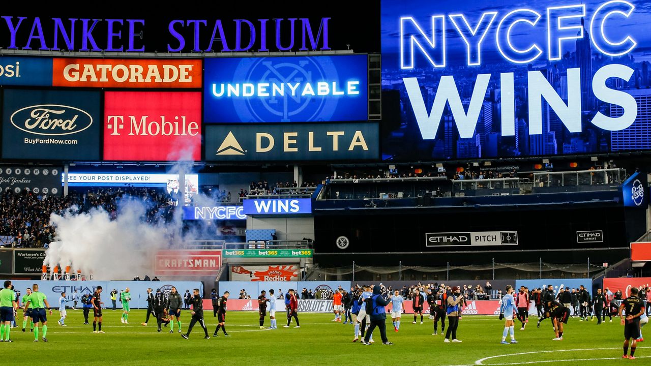 Players exit the field at the end of an MLS soccer match at Yankee Stadium on Sunday, Nov. 21, 2021.