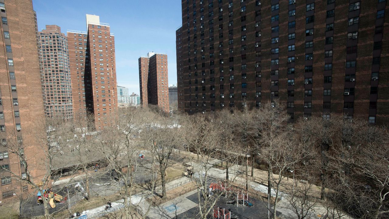 The New York City Housing Authority's John Haynes Holmes Towers are shown, Thursday, April 4, 2019, in New York. (AP Photo/Mark Lennihan)