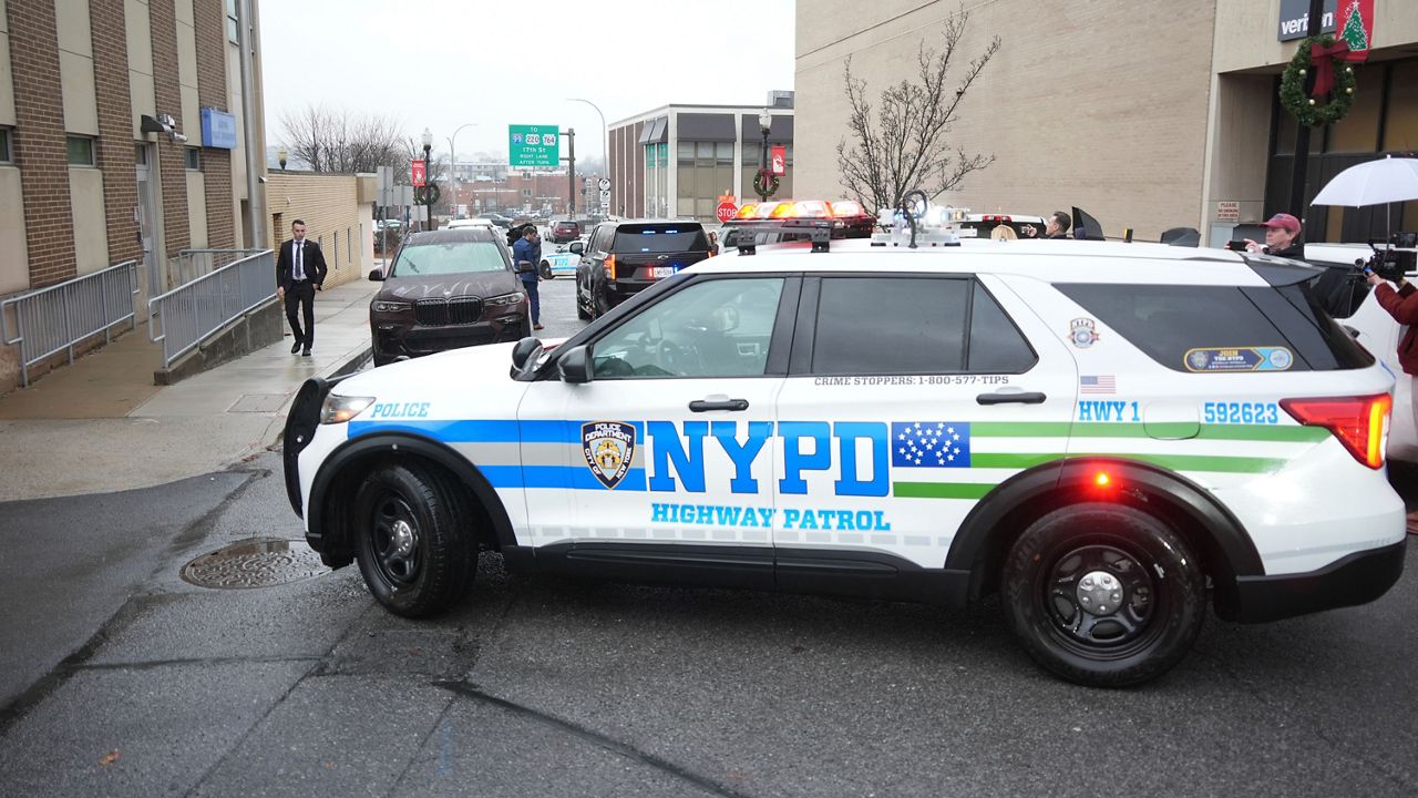 New York Police officers arrive at Altoona Police Department, where a man with a gun thought to be similar to the one used in the killing of UnitedHealthcare CEO Brian Thompson has been taken into police custody for questioning, Monday, Dec. 9, 2024, in Altoona, Pa. (AP Photo/Gene J. Puskar)