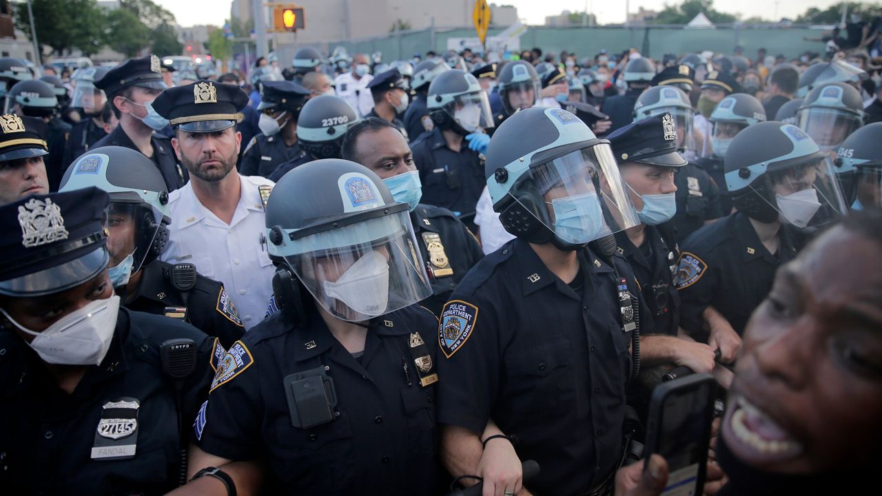 FILE - A large police presence is seen during a protest in the Brooklyn borough of New York, May 30, 2020, in response to the death of George Floyd, a Black man who was killed in police custody in Minneapolis. New York City’s police department has agreed to adopt new policies intended to safeguard the rights of protesters as part of a legal settlement stemming from its response to the Black Lives Matter demonstrations in 2020. The 44-page agreement, filed Tuesday, Sept. 5, 2023, in Manhattan federal court, requires the nation’s largest police department to deploy fewer officers to most public protests. (AP Photo/Seth Wenig, File)