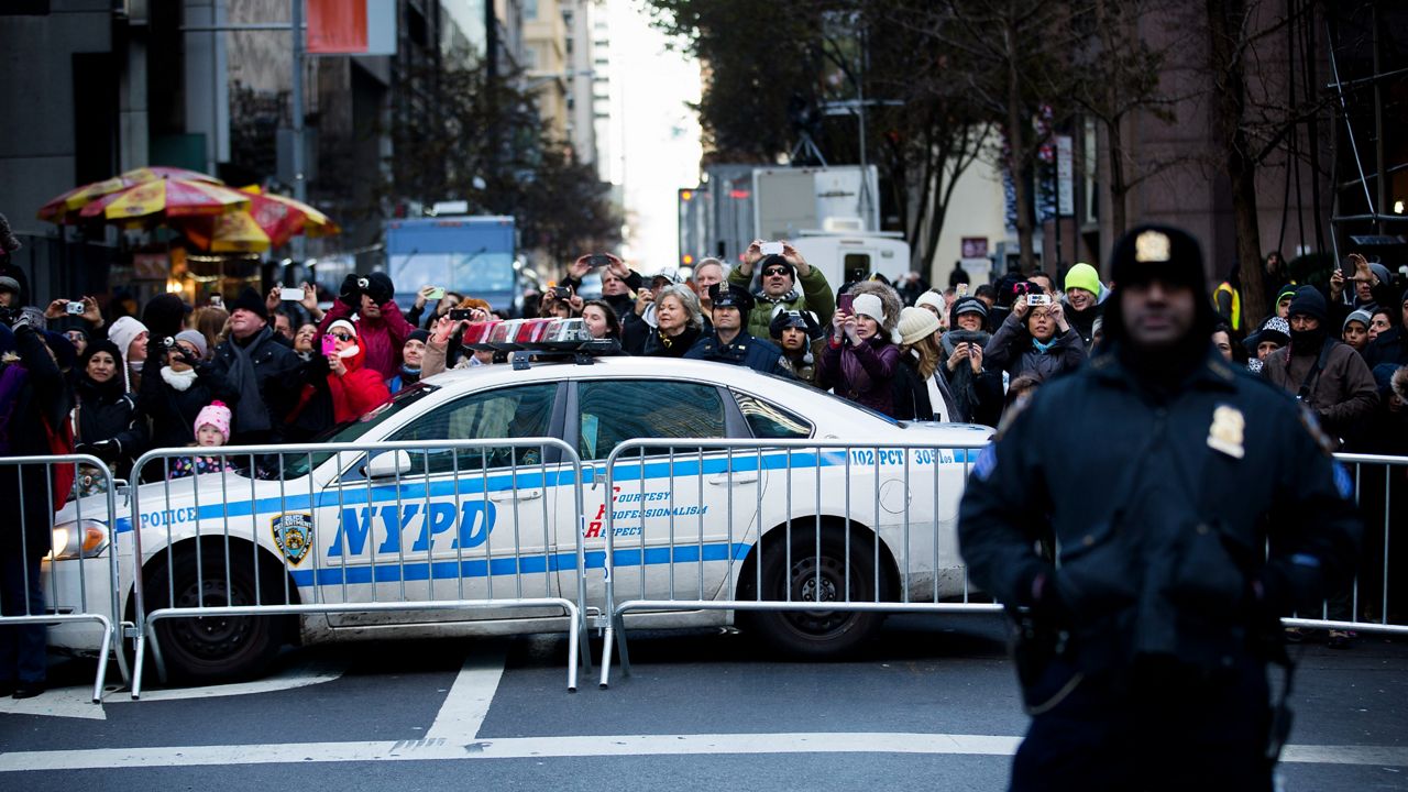 A police officer stands during the Macy's Thanksgiving Day Parade on Thursday, Nov. 28, 2013 in New York.