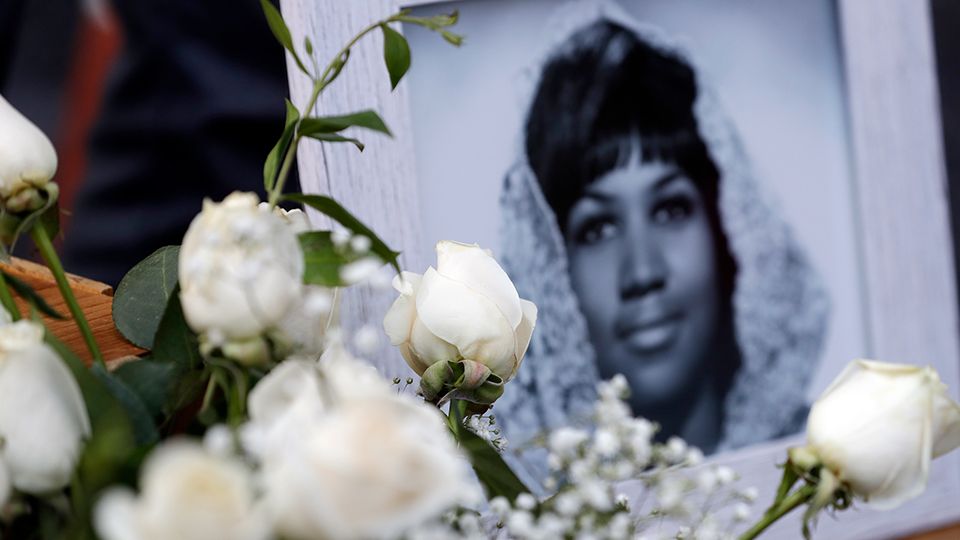 Flowers and pictures are placed on Aretha Franklin's star at the Hollywood Walk of Fame Thursday, Aug. 16, 2018, in Los Angeles. Franklin, the glorious "Queen of Soul" and genius of American song, died Thursday morning at her home in Detroit of pancreatic cancer. She was 76. (AP Photo/Marcio Jose Sanchez)