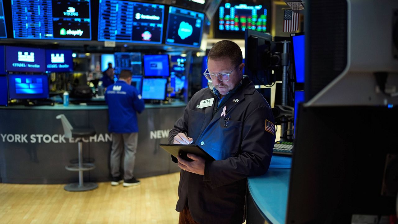 Traders work on the floor at the New York Stock Exchange in New York, Wednesday, Jan. 29, 2025. (AP Photo/Seth Wenig), File)