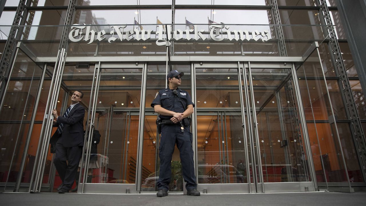 A police officer stands outside The New York Times building. (AP Photo/Mary Altaffer, File)
