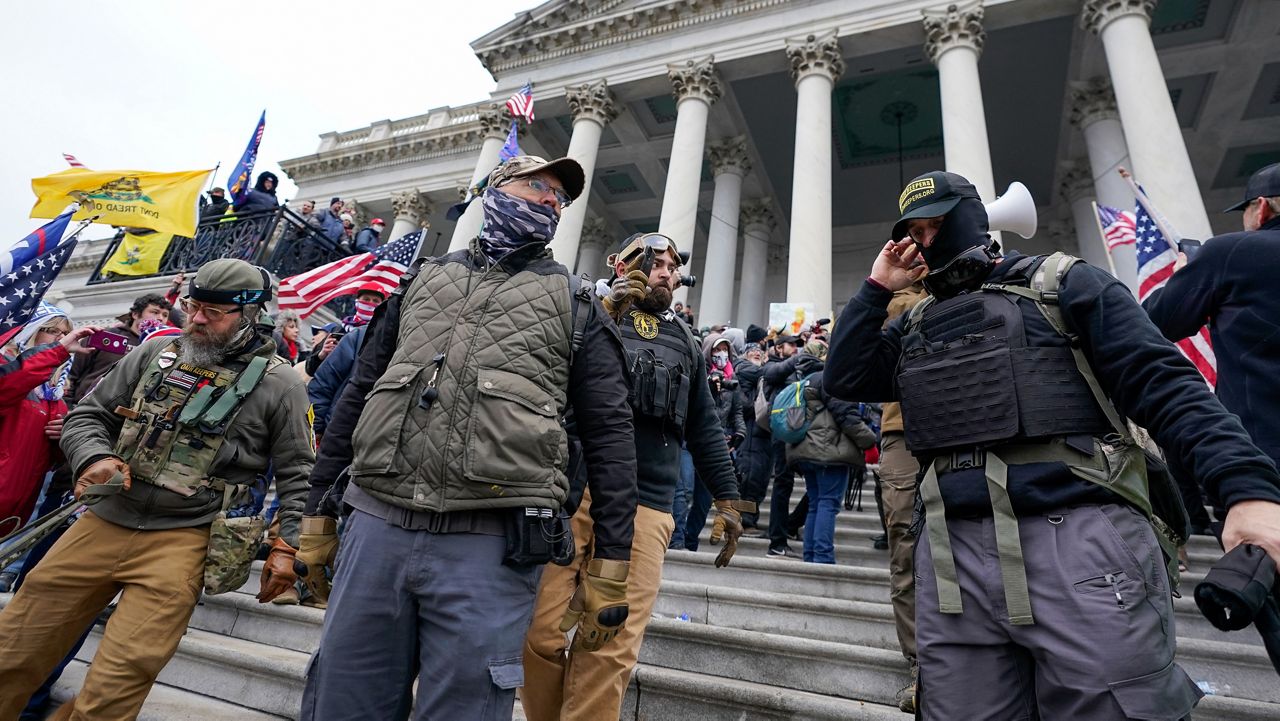 Members of the Oath Keepers on the East Front of the U.S. Capitol on Jan. 6, 2021, in Washington. A North Carolina man pleaded guilty on Wednesday, May 4, 2022, to conspiring with other members of the far-right Oath Keepers militia group to forcefully halt the peaceful transfer of power after President Joe Biden's 2020 electoral victory. William Todd Wilson, 44, is the third Oath Keepers member to plead guilty to a seditious conspiracy charge stemming from the Jan. 6, 2021, attack on the U.S. Capitol. (AP Photo/Manuel Balce Ceneta, File)
