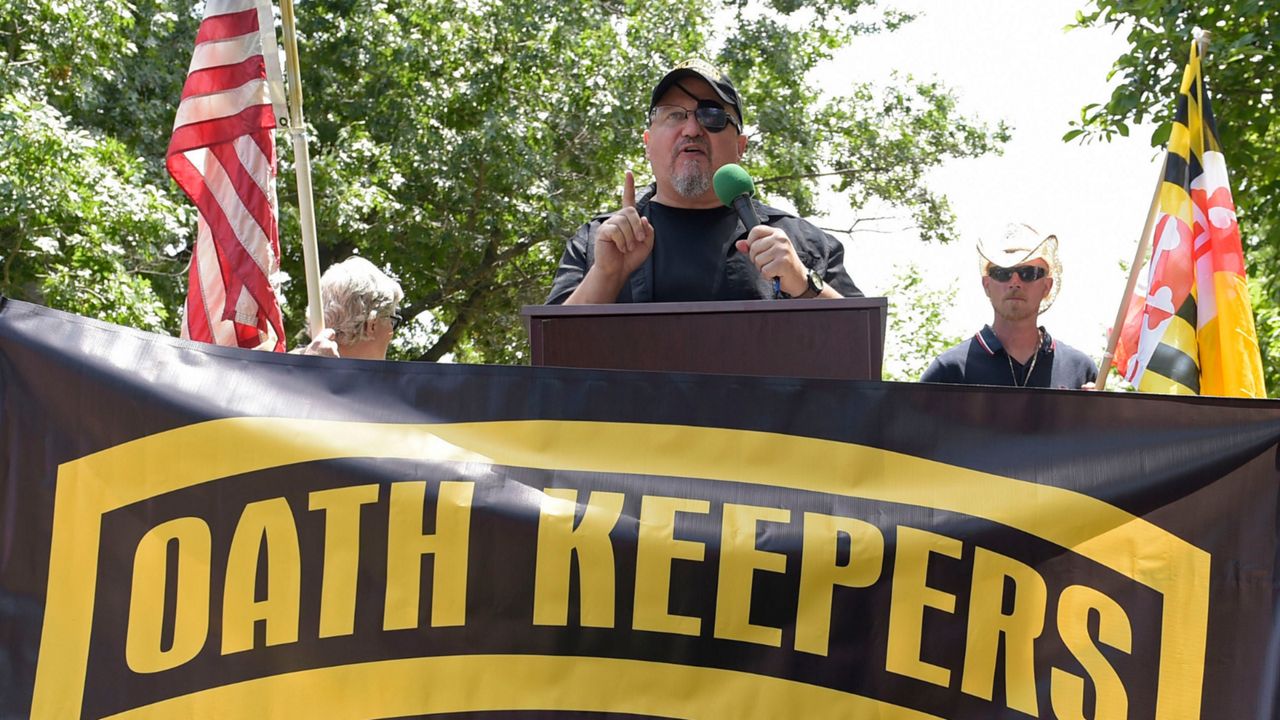 Stewart Rhodes, founder of the Oath Keepers, center, speaks during a rally outside the White House in Washington, June 25, 2017. Hundreds of pages of court documents in the case against Rhodes and four co-defendants, whose trial opens with jury selection Tuesday, Sept. 27, 2022, in Washington's federal court, paint a picture of a group so determined to overturn Biden's election that some members were prepared to lose their lives to do so. (AP Photo/Susan Walsh, File)
