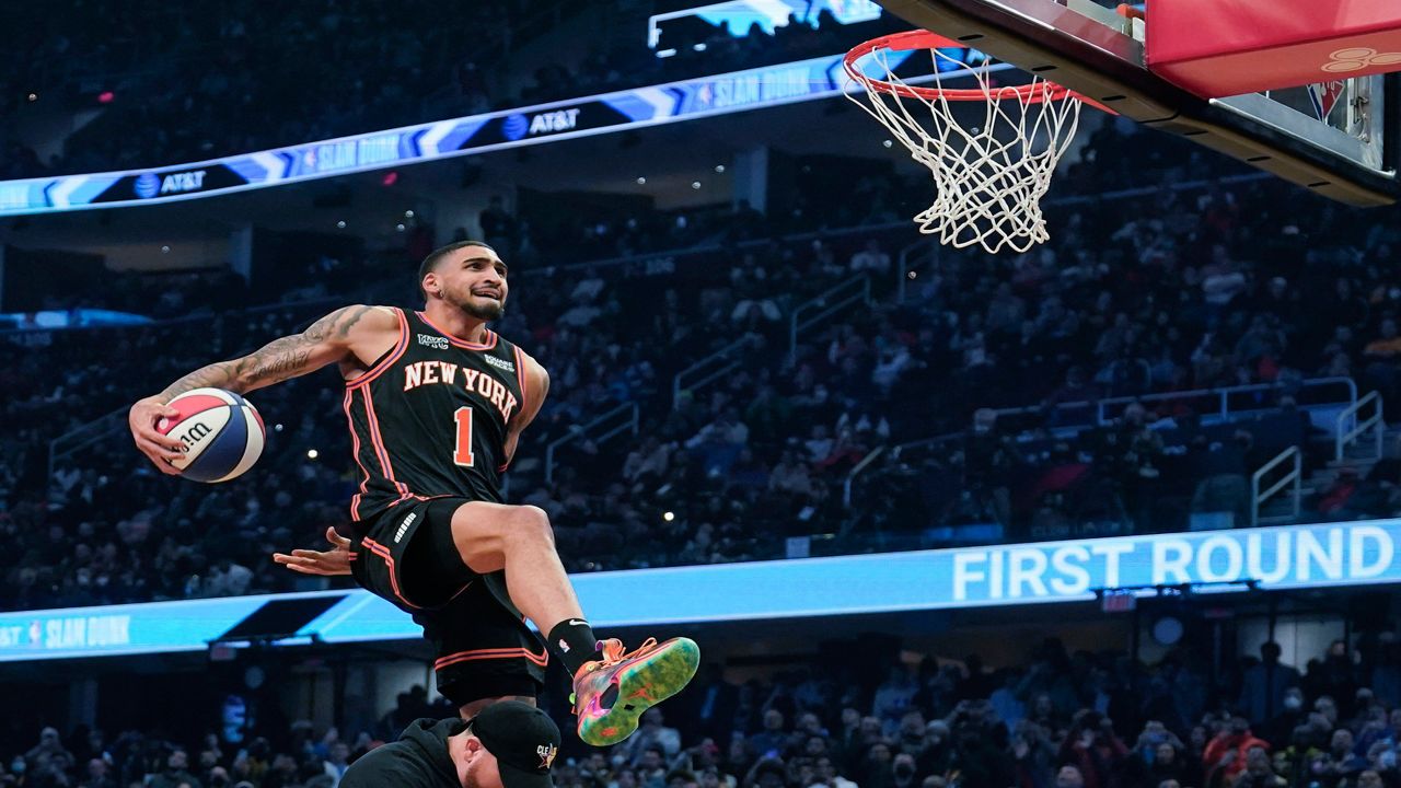 Obi Toppin leaps towards the basket during the dunk contest on Saturday, Feb. 19, 2022 in Cleveland.