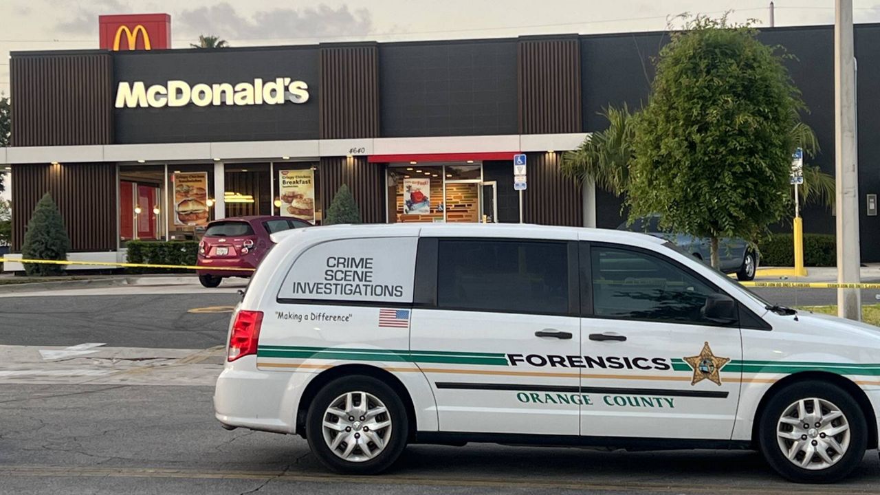 McDonald's employees began to arrive to work, saying they were not informed about the incident. Orange County Sheriff's Office (OCSO) Forensics team arrived on-scene to take photos around the restaurant. (Nicole Griffin/Spectrum News 13)