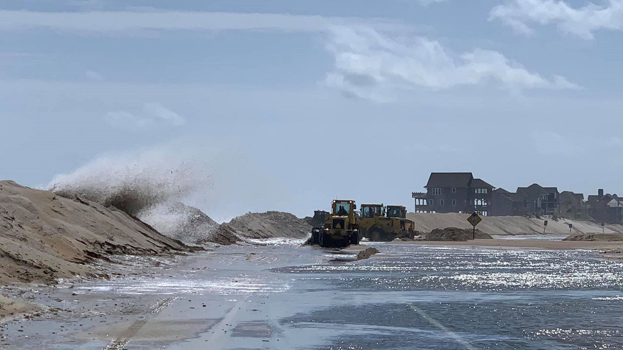 Ocean overwash along Highway 12 near Rodanthe Sunday afternoon. NCDOT photo.