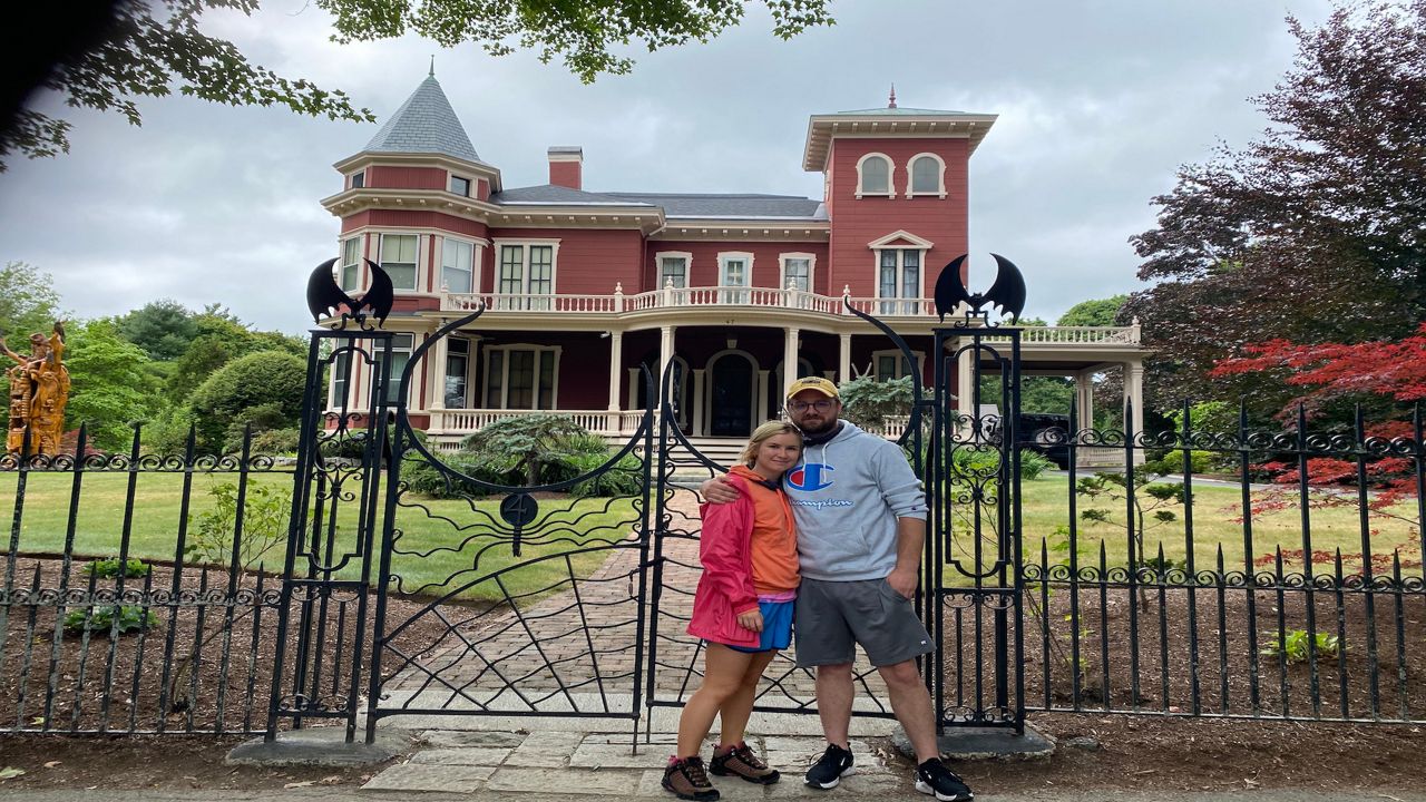 Brandon Lazenko and Shelby Wyant outside Stephen King's home in Maine. 
