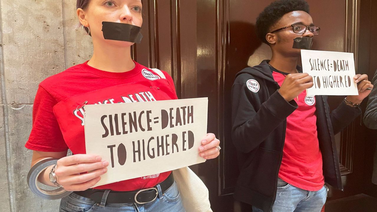 Opponents of a multifaceted higher education bill protest across the Ohio Statehouse in Columbus, Ohio, Wednesday, May 17, 2023. (AP Photo/Samantha Hendrickson)