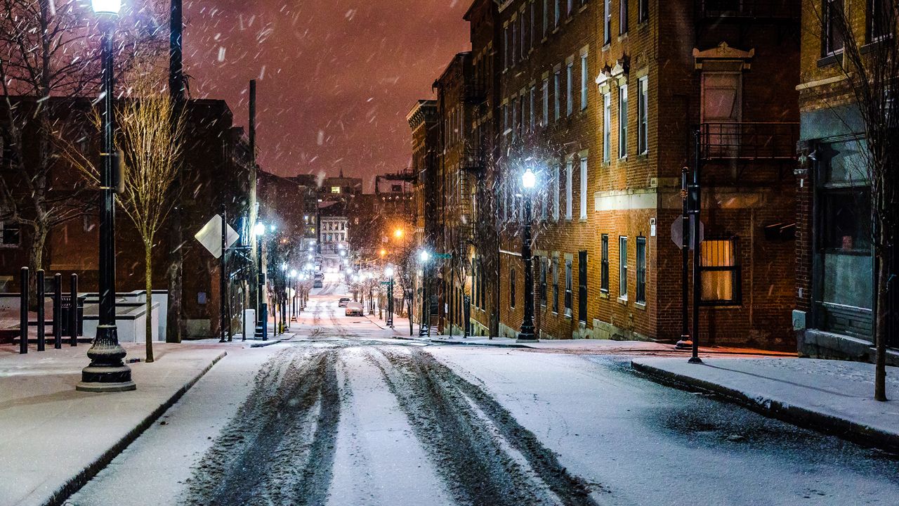 Snow tapers off overnight.