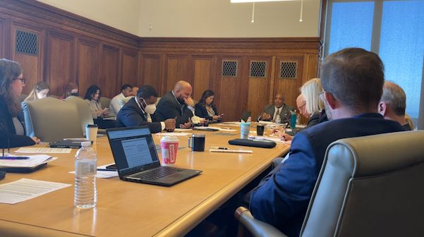 Council members sit around a table in city hall for Monday's caucus discussion of changes to public comment rules. (Spectrum News 1/Nora McKeown)