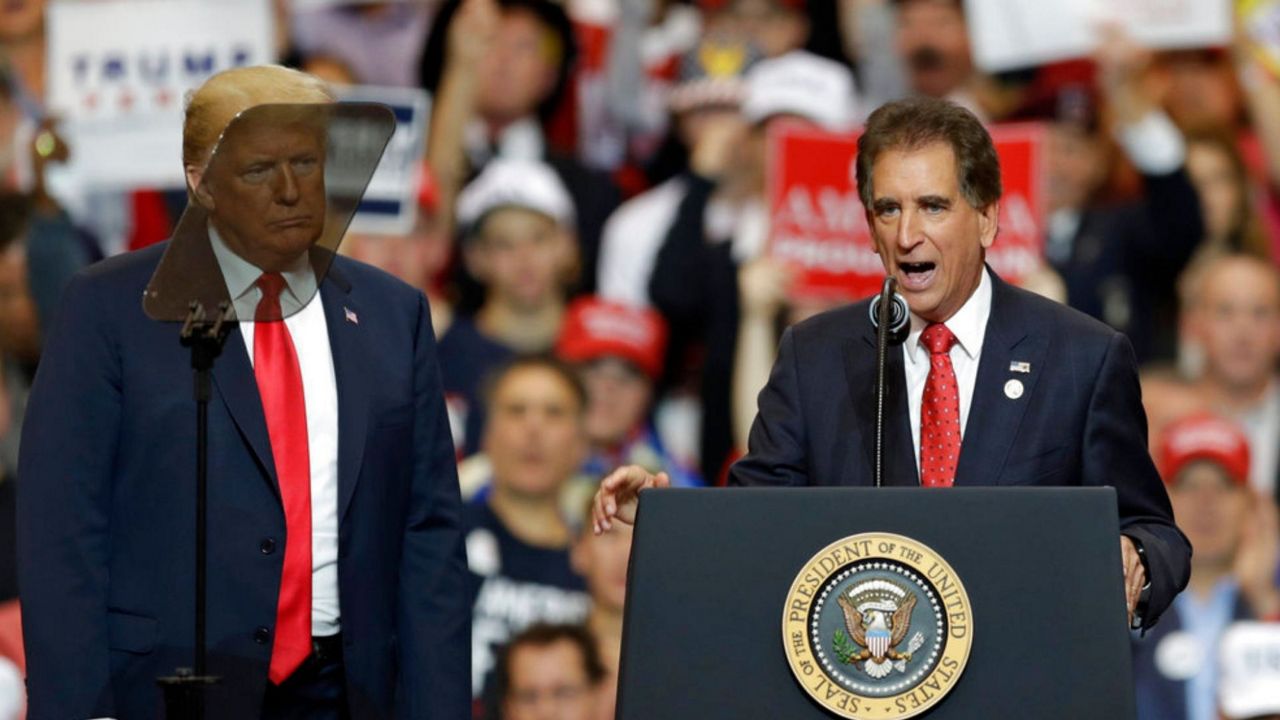 Former Rep. Jim Renacci campaigns with President Donald Trump. Associated Press photo