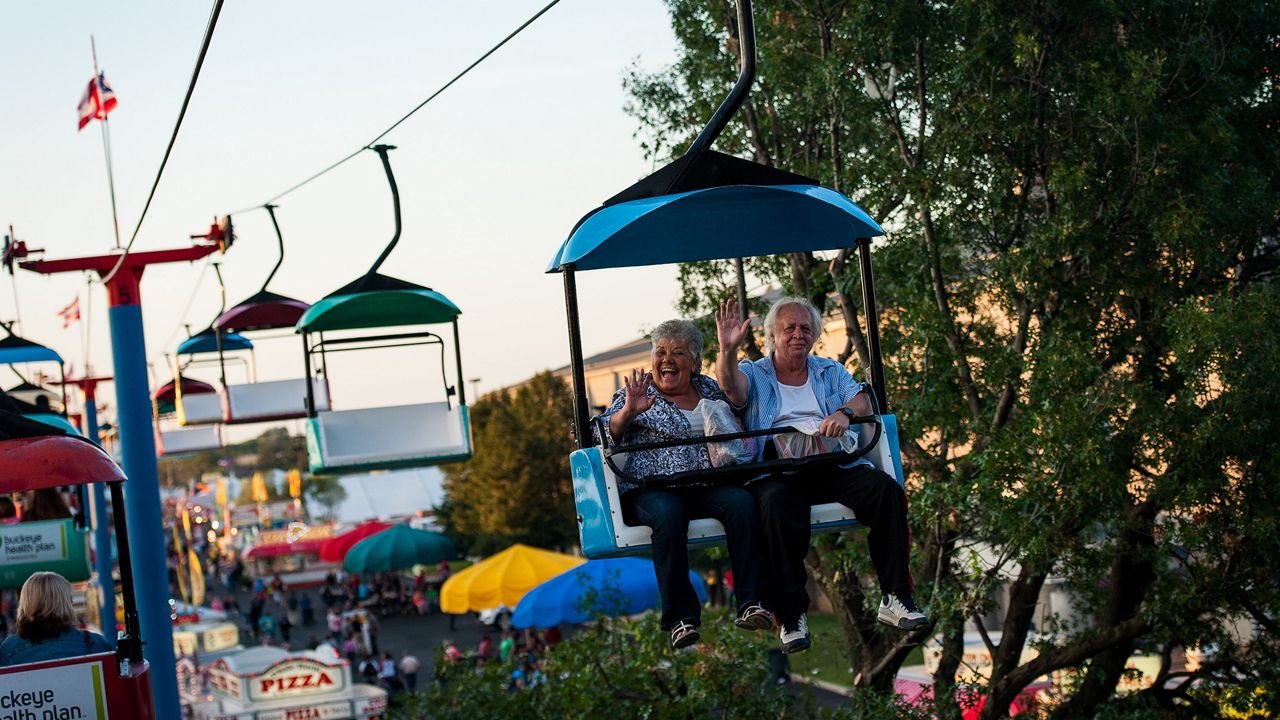 People on a ride at the Ohio State Fair.