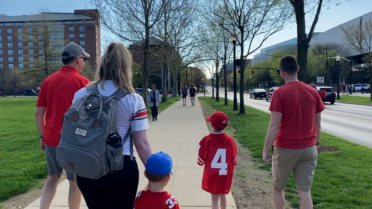 The Norris family walking around campus (Katie Priefer)