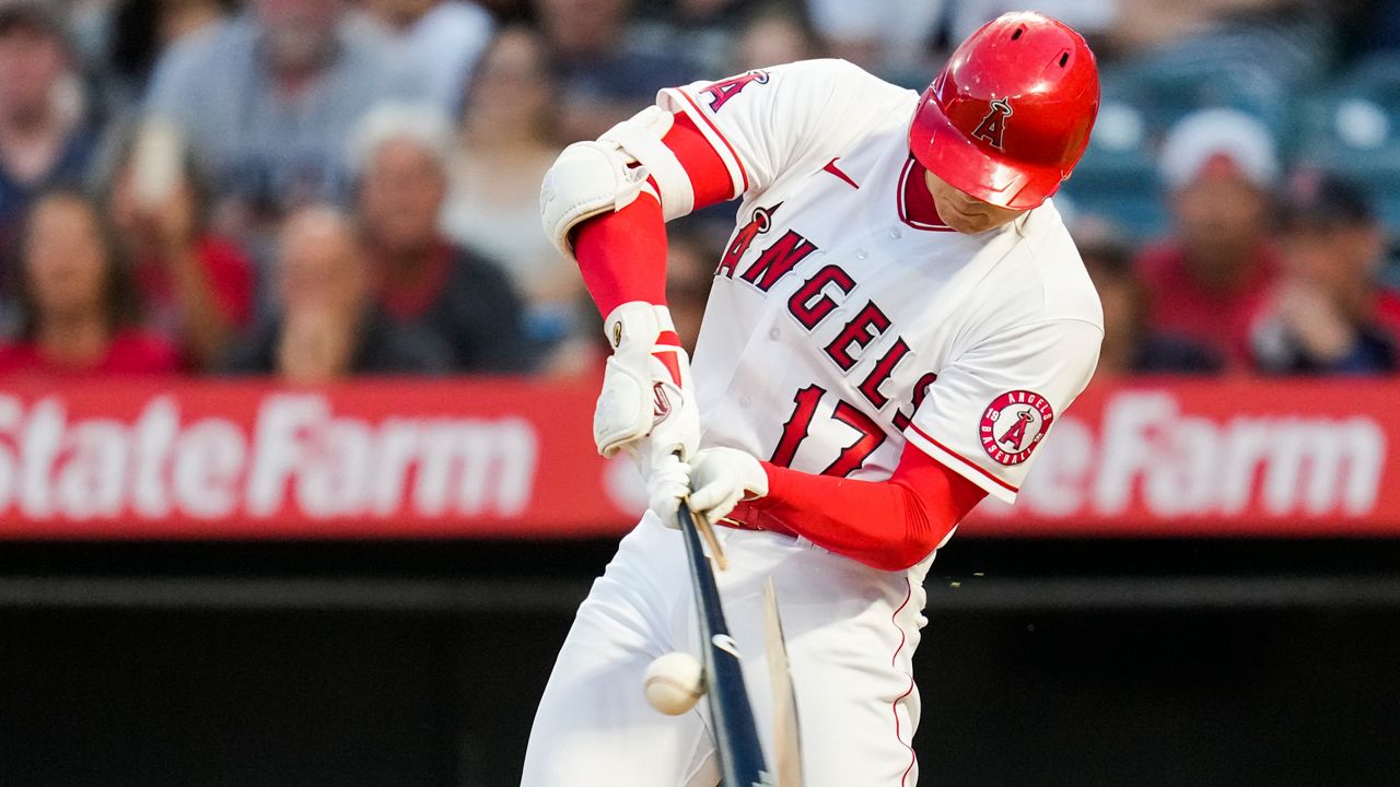 Los Angeles Angels designated hitter Shohei Ohtani (17) breaks a bat during a baseball game July 5, 2021, in Anaheim, Calif. (AP Photo/Ashley Landis)