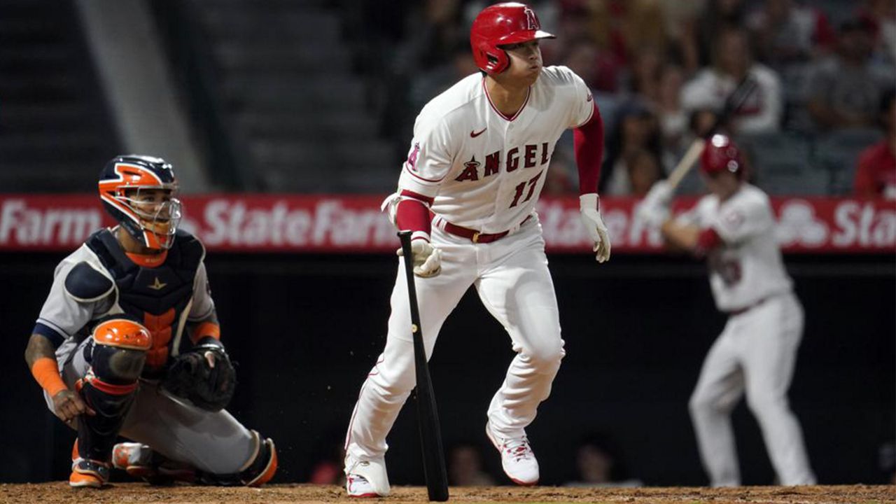 Los Angeles Angels' Shohei Ohtani follows through on a single during the sixth inning of a baseball game against the Houston Astros Tuesday, Sept. 21, 2021, in Anaheim, Calif. (AP Photo/Marcio Jose Sanchez)