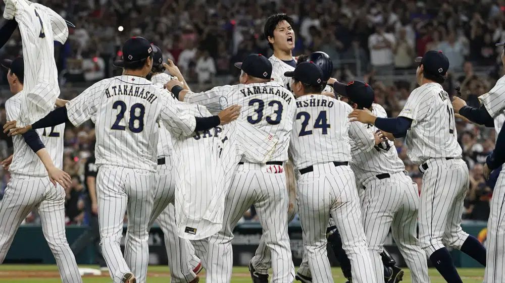 Japan pitcher Shohei Ohtani (16) celebrates after defeating the United States at the World Baseball Classic final game, Tuesday, March 21, 2023, in Miami. (AP Photo/Marta Lavandier)