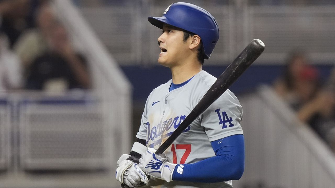 Los Angeles Dodgers' Shohei Ohtani (17) reacts after striking out during the fourth inning of a baseball game against the Miami Marlins, Wednesday, Sept. 18, 2024, in Miami. (AP Photo/Marta Lavandier)