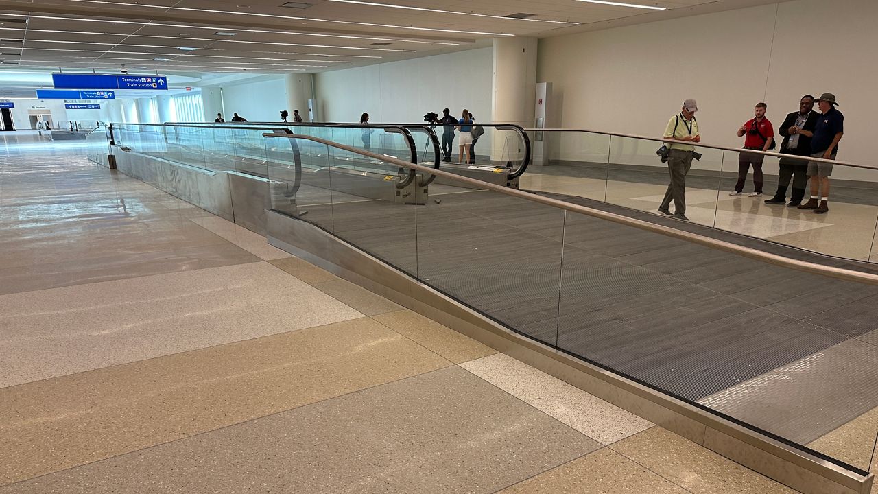 Officials at Orlando International Airport say the Terminal C pedestrian bridge is expected to open this summer. (Spectrum News/Asher Wildman)    photo by Asher Wildman