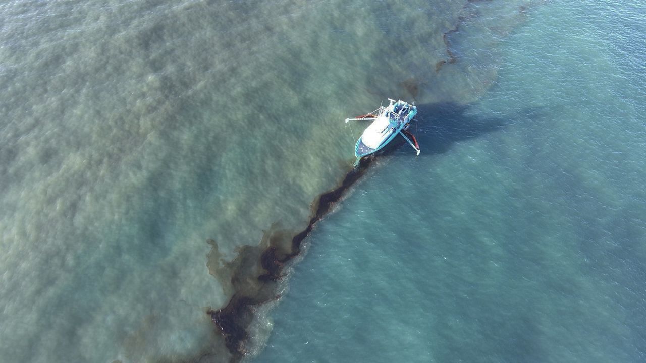 In this photo provided by the U.S. Coast Guard, a Clean Gulf Associates 95-foot response vessel skims crude oil approximately 4 miles southeast off South Pass, La., Friday, Nov. 17, 2023.  (U.S. Coast Guard/Courtesy Clean Gulf Associates via AP)