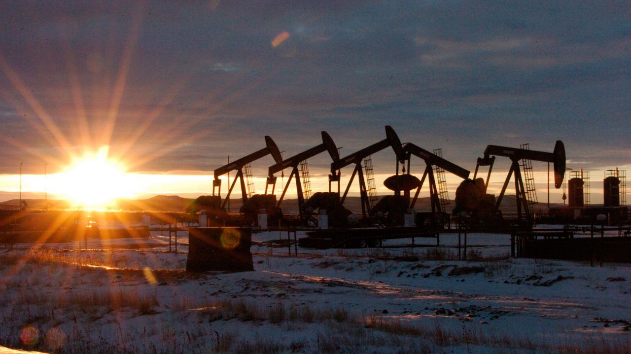 Oil pump jacks in McKenzie County in western N. D., Jan. 14, 2015. Nineteen Republican state attorneys general have asked the U.S. Supreme Court to get involved in a dispute over climate-change lawsuits. (AP Photo/Matthew Brown, File)