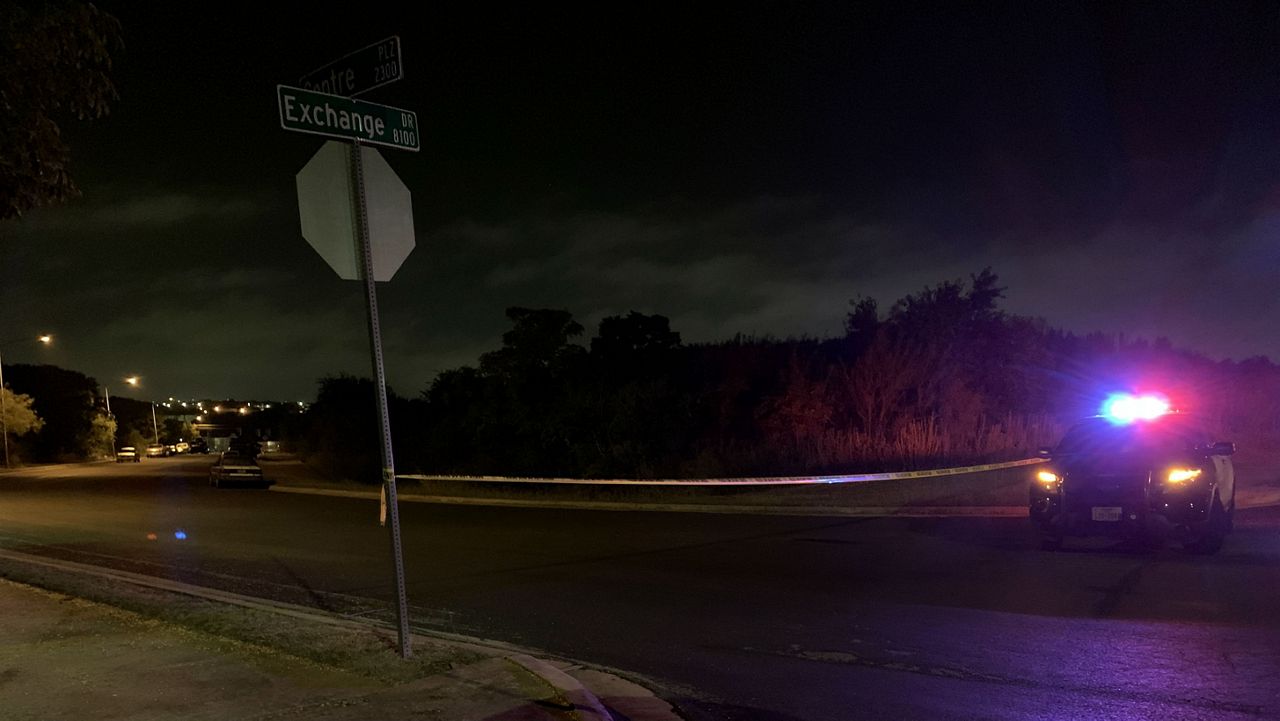 Austin Police car blocking the intersection of Exchange Dr. and Centre Plaza near the Salado at Walnut Creek Apartments. (Stacy Rickard/Spectrum News)