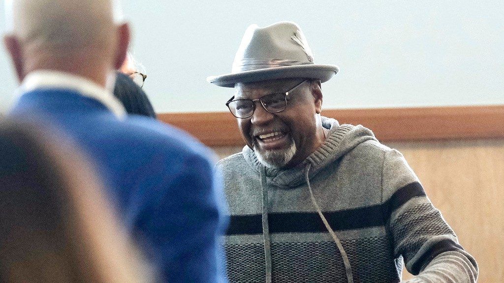 Glynn Simmons reacts after stepping out of the courthouse after Judge Amy Palumbo ruled to approve his "actual innocence" claim during a hearing at the Oklahoma County Courthouse Tuesday, Dec. 19, 2023, in Oklahoma City, Okla. (Doug Hoke/The Oklahoman via AP)