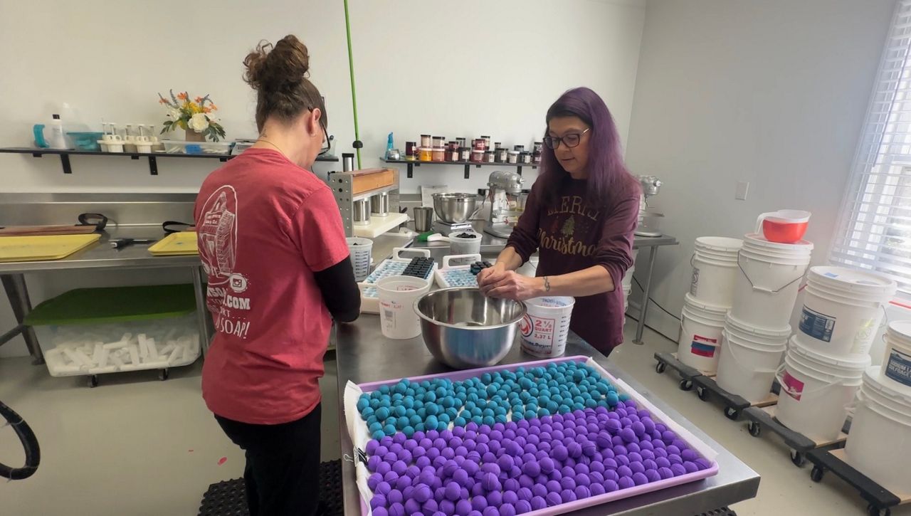Old Town Soap Co. employees work at the manufacturing site in Landis, North Carolina. (Spectrum News 1/Molly Hurley)