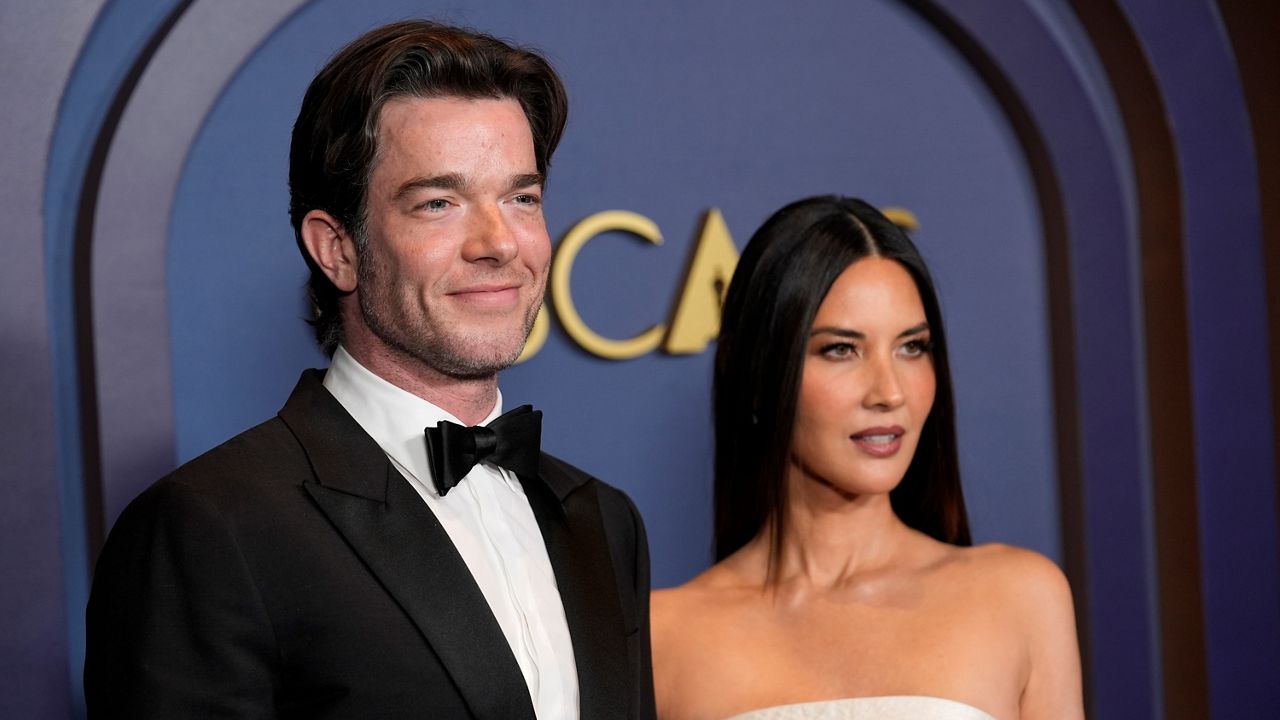 John Mulaney, left, and Olivia Munn arrive at the Governors Awards on Jan. 9, 2024, at the Dolby Ballroom in Los Angeles. (AP Photo/Chris Pizzello)