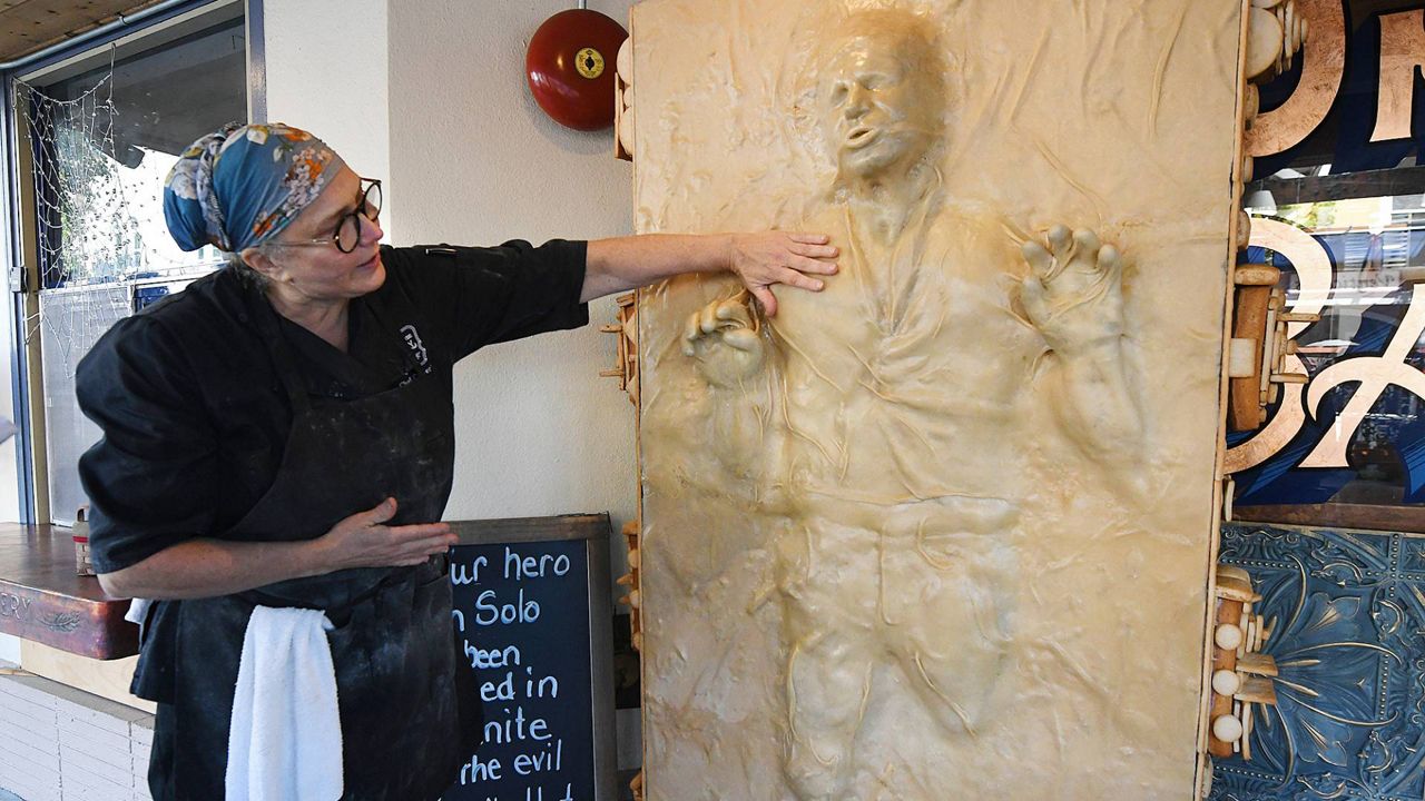 Catherine Pervan, with One House Bakery in Benicia, Calif., talks about creating the life-sized Han Solo on Thursday. (Chris Riley/The Times-Herald via AP)